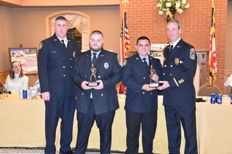 Firefighter Brice Trossbach and Lieut. Nick Martoni receive the award for top runners.